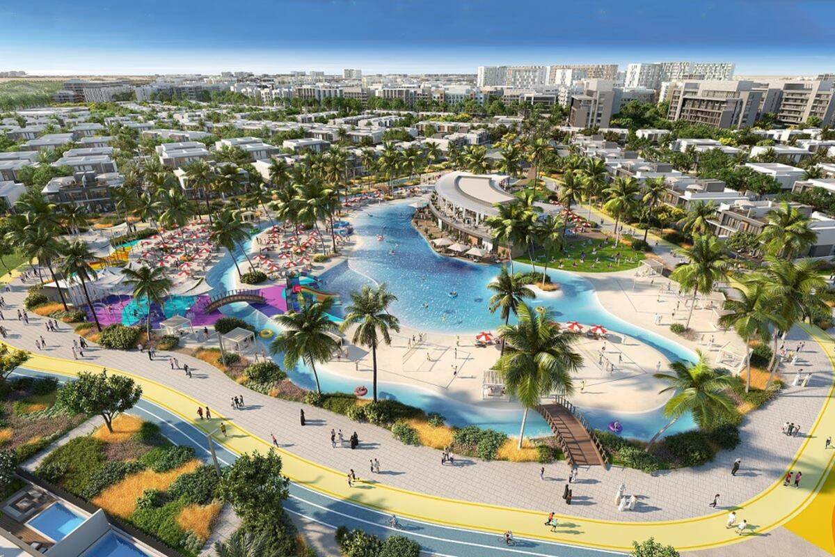 Comunità residenziale a Dubai South con laguna, palme e townhouse